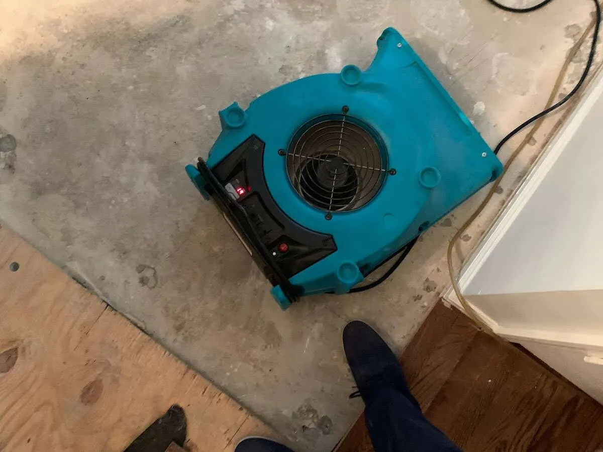 Air mover drying subfloor during Commercial Water Damage Restoration in Hopewell